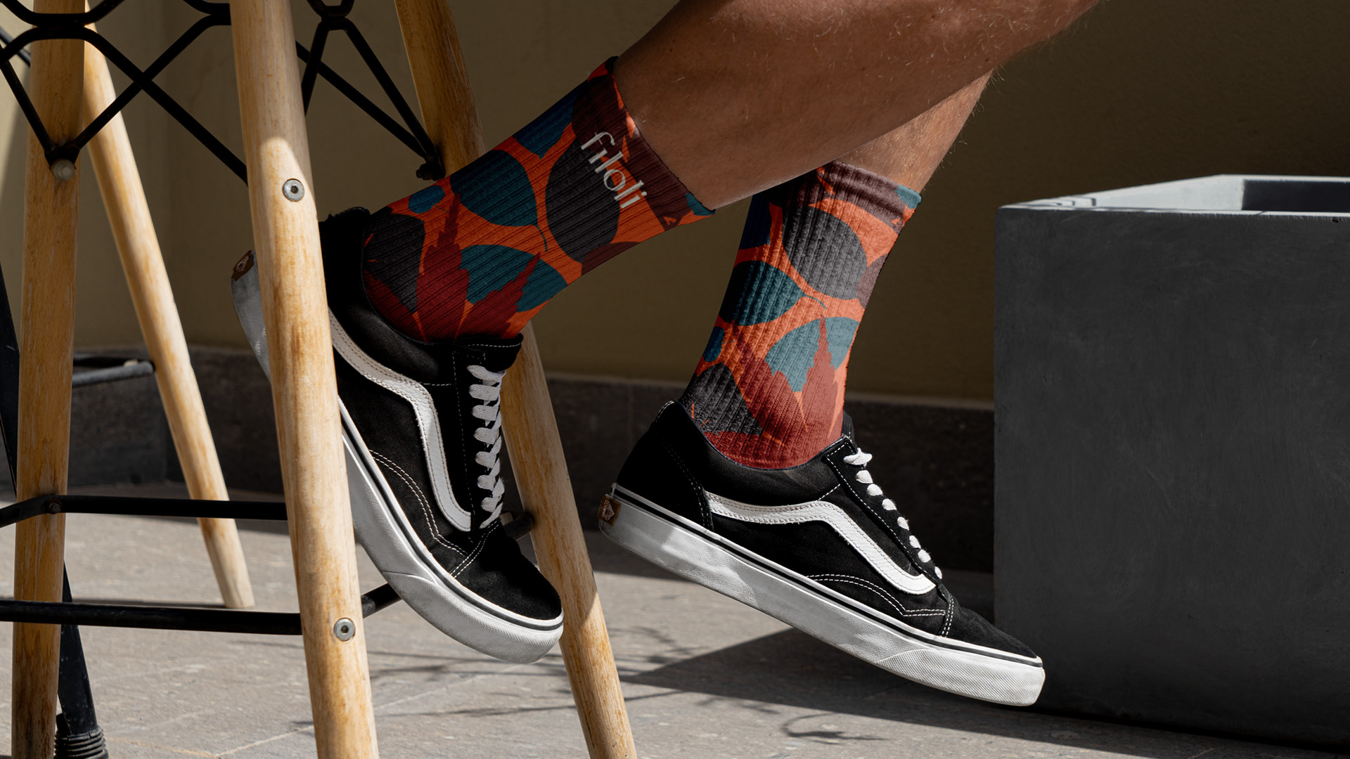 Socks printed with Filoli's leaf pattern, worn with black sneakers