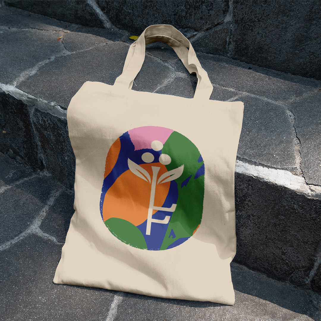 Canvas tote bag with Filoli's illustrated key-and-leaf emblem