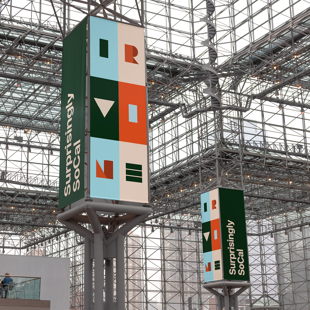 Hanging Irvine signage towers in a convention hall