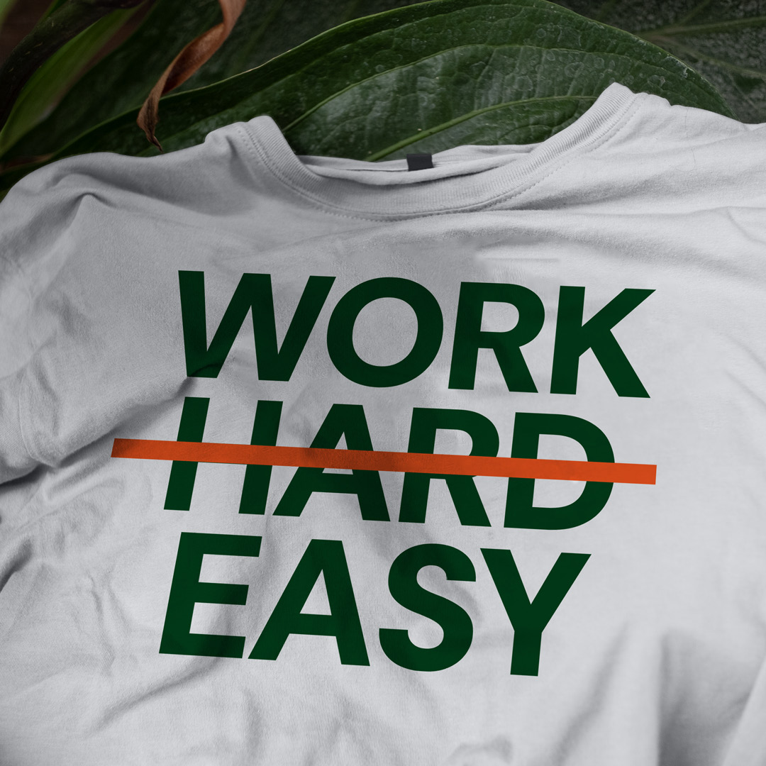 T-shirt reading 'Work hard easy' with 'hard' crossed out